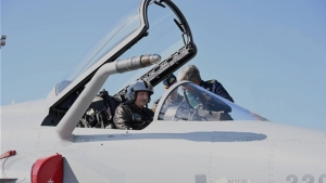 Photo of the President of Azerbaijan inspecting the cockpit of a JF-17 fighter aircraft. This image is a hero for an article.